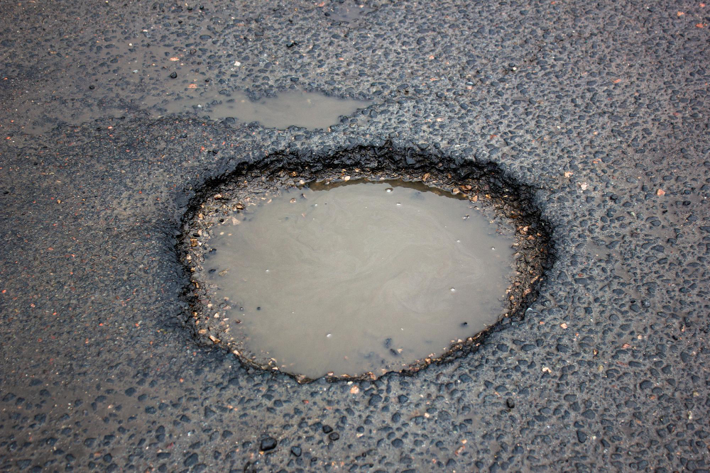 How Potholes Are Repaired and the Importance of Sealcoating