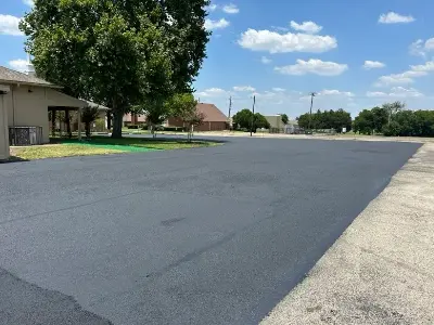 Commercial asphalt parking lot repair through crack sealing