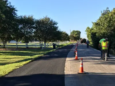 PMG Paving & Maintenance Contractors working on an asphalt paving