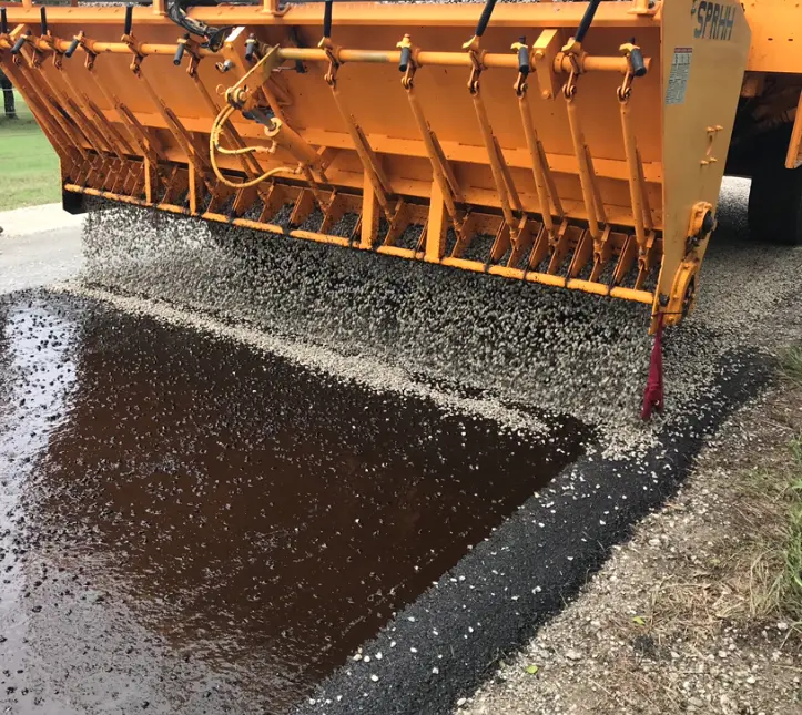 Chip sealed road surface by PMG Paving & Maintenance